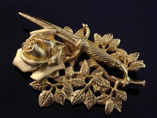 A 1990s gilded Rose & Dagger brooch, bearing the signature Rene Magritte, 2.75in.